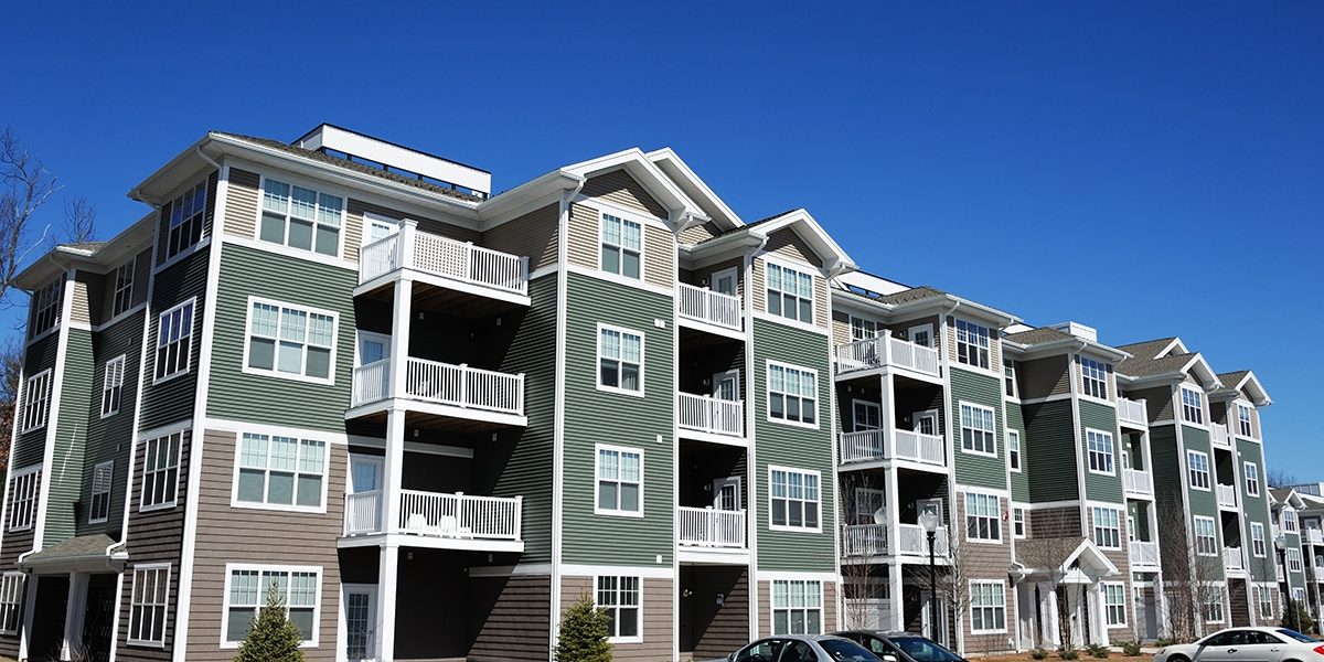Low,Angle,View,Of,Modern,Apartment,Building,In,Nh